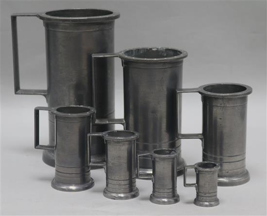 Seven French Provincial graduated pewter measures